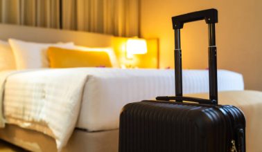 Suitcase delivered standing in hotel room. concept of Hotel service and travel